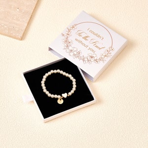 Pearl flower girl bracelet with round white bead band and small pearl charm