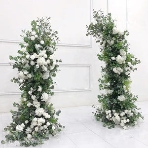 Greenery and white flower arch pillar arrangement, tall floral column pair