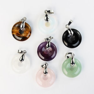 Assorted gemstone donut pendants with silver bails, purple, pink, black, green, amber