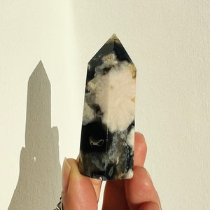 Black flower agate crystal obelisk with white veining, pointed top