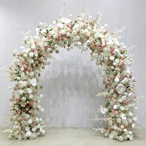 U-shaped floral arch with blush, white, and pink blossoms for wedding decor
