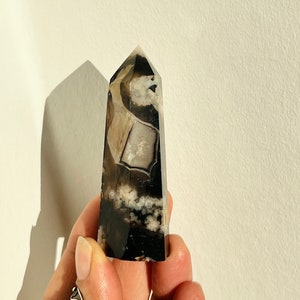 Black flower agate crystal tower obelisk, polished dark stone with white veining