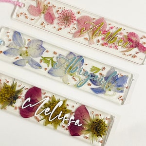 Floral resin bookmark set with pressed flowers and cursive lettering, assorted colors