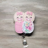 Swaddled Baby Girls | pink flowers blanket | baby burrito | labor and deliver | L&D | NICU | mother and baby | newborn | preemie | pediatric