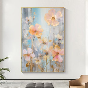 Abstract floral oil painting on canvas with pastel peach and pink blooms in a gold-toned frame