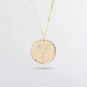 Gold round pendant necklace with engraved birth-flower bouquet design disc