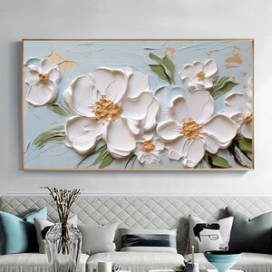 Framed canvas wall art with raised white blossom flowers and soft green leaves