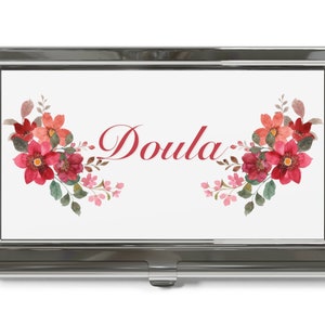 Business card holder with floral corners and red 'Doula' script text