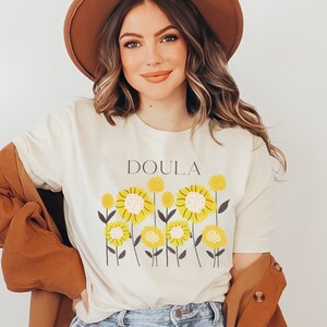 Cream T-shirt with wildflower print and DOULA text, short sleeves