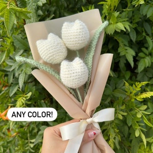 Handmade crochet tulips bouquet with fabric wrap and white tulip blooms, tied ribbon
