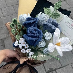Crochet flower bouquet with blue and white blooms and green leaves, with pattern sheet