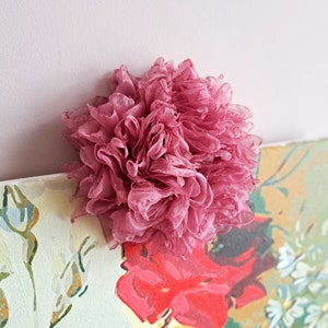 Pink ruffled organza flower brooch with layered petals
