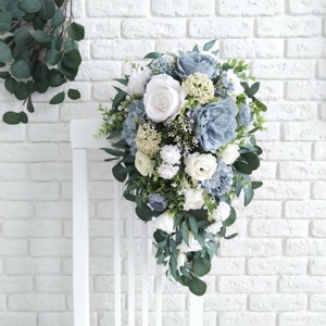 Bridal eucalyptus cascading bouquet with white flowers and light blue blooms