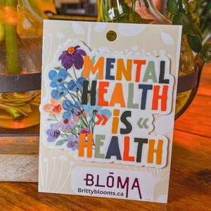Waterproof mental health sticker sheet with colorful flowers and "Mental Health is Health" text