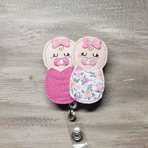 Newborn baby mittens with floral pattern, dark pink and white