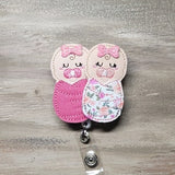 Swaddled Baby Girls | dark pink and flowers blanket | baby burrito | labor and deliver | L&D | NICU | mother and baby | newborns | preemies