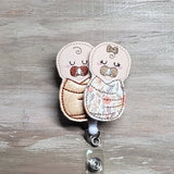 Swaddled Baby Boy and Girl | brown flowers blanket | baby burritos | labor and deliver | L&D | NICU | mother and baby | newborns | twins