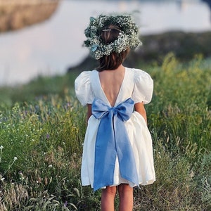 Boho flower girl dress with blue sash bow and puff sleeves, ivory and dusty blue