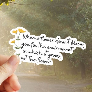 Water-resistant vinyl sticker with quote "When a flower doesn't bloom"