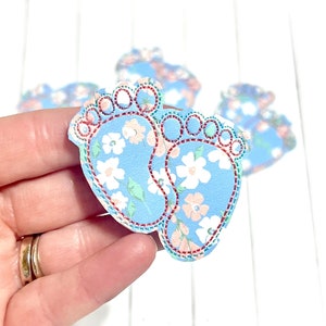 Blue floral baby feet felties with decorative lace trim and dangling bead accents