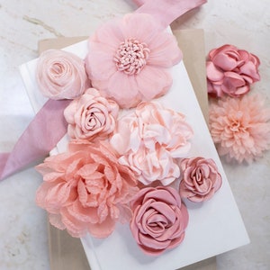 Variety bundle of 3D fabric flowers in pink and peach tones, assorted on white display cards