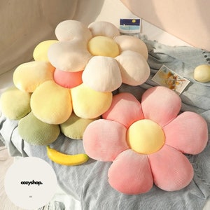 Stuffed six-petal flower cushion, cream and pink petals with yellow centers