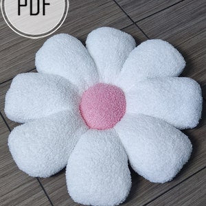 Light blue plush flower cushion with rounded petals and pink center