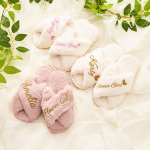 Fluffy kids slippers with embroidered 'Flower Girl' text, pink and white pairs