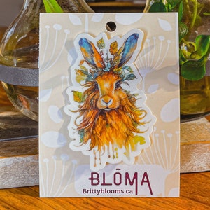 Vinyl water bottle sticker with colorful rabbit illustration, orange-blue, white backing