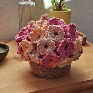 Crochet flower-shaped coasters, pink and beige with scalloped petals