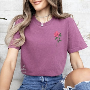 Purple embroidered birth month flower T-shirt with small pink rose logo