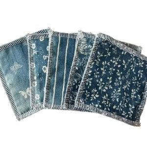 Pack of 5 cotton reusable wipes, denim blue with assorted floral prints and stitched edges