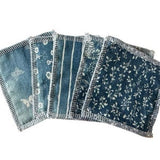 Pack of 5 cotton reusable wipes, denim blue with assorted floral prints and stitched edges