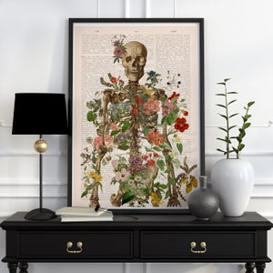 Framed anatomical skeleton and flower wall art print, vintage-style floral details