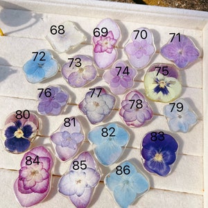 Handmade resin pressed-flower jewelry charms, assorted purple, blue, and pink