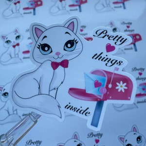 Cat sticker with blue kitten and bow, Pretty things inside text.