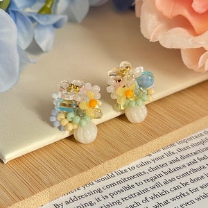 Floral beaded stud earrings in 14K gold with pastel flower design