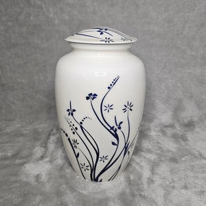 White floral cremation urn with blue vine and flower design, domed lid