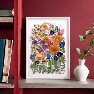 Framed pressed flower wall art with colorful wildflower collage