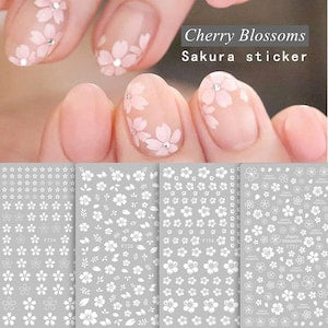 Set of white cherry blossom nail art stickers with outlined floral decals