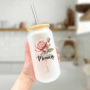 Frosted glass tumbler with pink rose floral design and custom name 'Monica', straw