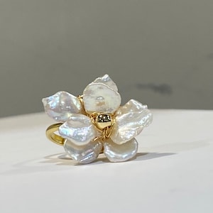 Freshwater pearl flower ring with gold-tone band and white petal pearls