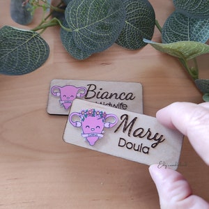 Personalized wooden ID badge with engraved flowers and two caregiver names, light lavender