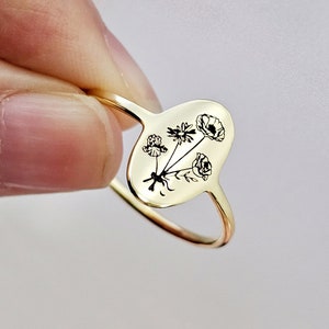Gold-tone heart-shaped birth flower ring with engraved bouquet and small leaves
