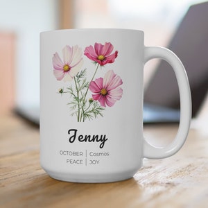 Light gray 15 oz ceramic mug with pink cosmos flowers, custom name and 'October | Peace | Joy'