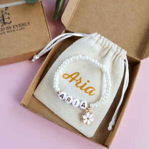 Personalized flower girl bracelet, pearl beads with small flower charm in pouch