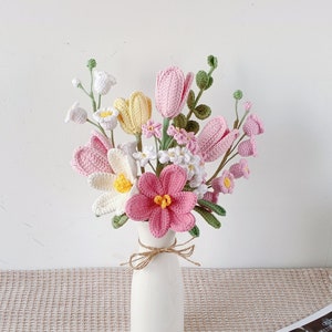 Pink and white crochet tulip flowers bouquet in a small white vase
