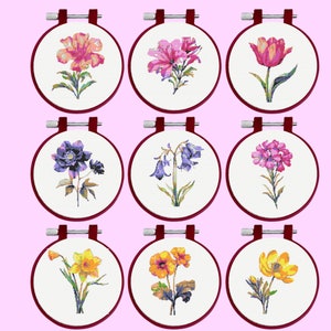 Cross stitch pattern bundle with nine flower designs in embroidery hoops
