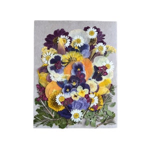 Edible flower and herb assortment, mixed purple, yellow, and blue blooms on a card