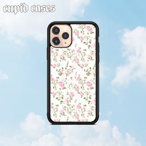 Vintage floral phone case with pink and green flowers on a cream background, black frame